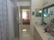 Double vanity bathroom with a view of a bedroom at 2122 King Richards Ct, Orange City, FL 32763