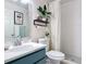 Neat bathroom featuring a vanity with a white countertop and sleek white tile at 2122 King Richards Ct, Orange City, FL 32763