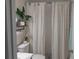 Clean bathroom featuring a shower with linen curtains and a modern vanity at 2122 King Richards Ct, Orange City, FL 32763