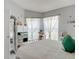 Inviting bedroom with soft, sheer curtains and cozy white bedding at 2122 King Richards Ct, Orange City, FL 32763