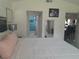 View from Primary bedroom looking toward en-suite bath and entry, with views into living areas at 2122 King Richards Ct, Orange City, FL 32763