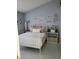 Bright bedroom featuring a comfortable bed with stylish decor and ample closet space for storage at 2122 King Richards Ct, Orange City, FL 32763