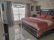 Relaxing bedroom with a king-size bed, large window, and plush bedding at 2122 King Richards Ct, Orange City, FL 32763