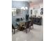 Elegant dining room with modern table, chairs, chandelier, and stylish decor at 2122 King Richards Ct, Orange City, FL 32763