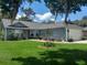 Charming single-story home features a well-manicured lawn and attached two car garage at 2122 King Richards Ct, Orange City, FL 32763