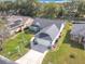 Lovely aerial view of a home with a pristine lawn, manicured landscaping, and a welcoming driveway at 2122 King Richards Ct, Orange City, FL 32763