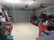 Attached garage with storage and motorcycle at 2122 King Richards Ct, Orange City, FL 32763