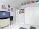 Flex room featuring both a home gym and entertainment setup with a large TV and storage at 2122 King Richards Ct, Orange City, FL 32763
