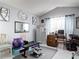 Home gym and office space with workout equipment and functional desk area at 2122 King Richards Ct, Orange City, FL 32763
