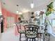 Bright eat-in kitchen area with a breakfast nook and views of the cooking and food prep areas at 2122 King Richards Ct, Orange City, FL 32763