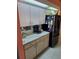 Kitchen featuring white cabinets and dark appliances at 2122 King Richards Ct, Orange City, FL 32763
