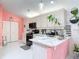 Clean kitchen design with white cabinets, stainless steel appliances and decorative accents at 2122 King Richards Ct, Orange City, FL 32763