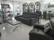 Relaxing living room with comfy seating and large windows at 2122 King Richards Ct, Orange City, FL 32763