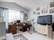 Home office area with decor, including a television at 2122 King Richards Ct, Orange City, FL 32763