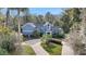 Large home with a circular driveway and mature trees at 2229 Earleaf Ct, Longwood, FL 32779