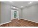 Charming bedroom with wood flooring, striped wallpaper and ensuite bathroom at 2229 Earleaf Ct, Longwood, FL 32779