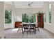 Dining area with wood table and chairs, and view to backyard at 2229 Earleaf Ct, Longwood, FL 32779