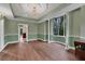 Spacious dining room with hardwood floors and view to kitchen at 2229 Earleaf Ct, Longwood, FL 32779