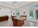 Kitchen features an island and opens to Gathering room and pool at 2229 Earleaf Ct, Longwood, FL 32779
