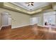Large main bedroom with hardwood floors and access to the bathroom and closet at 2229 Earleaf Ct, Longwood, FL 32779