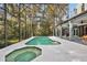 Inviting pool and spa with screened enclosure, expansive patio, and lush landscaping at 2229 Earleaf Ct, Longwood, FL 32779