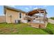 Wooden pergola with steps leading up to a deck at 2487 Empress Dr, Kissimmee, FL 34741