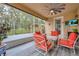 Relaxing screened porch with seating area and view of backyard at 2487 Empress Dr, Kissimmee, FL 34741