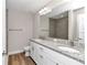 Bathroom with granite vanity and tiled shower at 25 Locust Loop Ln, Ocala, FL 34472