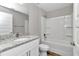 Clean bathroom with shower/tub combo and granite vanity at 25 Locust Loop Ln, Ocala, FL 34472