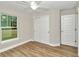 Spacious bedroom with ceiling fan and large closet at 25 Locust Loop Ln, Ocala, FL 34472