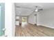 Open living area with vinyl plank flooring and neutral walls at 25 Locust Loop Ln, Ocala, FL 34472