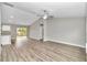 Open living area with kitchen and dining views, vinyl flooring, and ceiling fan at 25 Locust Loop Ln, Ocala, FL 34472