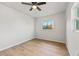 Bright bedroom with wood-look floors and a ceiling fan at 2800 E Anderson St, Orlando, FL 32803