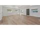 Spacious living room with light gray walls and wood-look floors at 2800 E Anderson St, Orlando, FL 32803