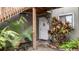 Inviting condo entry with lush landscaping at 293 Scottsdale Sq # 293, Winter Park, FL 32792