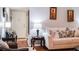 Comfortable living room featuring a cozy sofa and hardwood floors at 293 Scottsdale Sq # 293, Winter Park, FL 32792