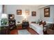Living room with hardwood floors and a daybed at 293 Scottsdale Sq # 293, Winter Park, FL 32792