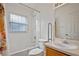 Clean bathroom with a shower/tub combo and grab bars at 330 Ballyshannon Dr, Davenport, FL 33897