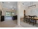 Dining room with table and chairs, open to the living room at 3441 Sterling Lake Cir, Oviedo, FL 32765