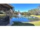 Scenic pond view from a covered gazebo at 533 Shining Armor Ln, Longwood, FL 32779