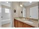 Double vanity bathroom with granite countertop at 5423 Calla Lily Ct, Kissimmee, FL 34758