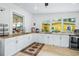 Outdoor kitchen featuring granite countertops and white cabinets at 5423 Kenmore Ln, Orlando, FL 32839