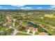 Wide aerial view of community with golf course and pond at 545 Brown Pelican Dr, Daytona Beach, FL 32119