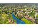 Aerial view of community with golf course and waterfront properties at 545 Brown Pelican Dr, Daytona Beach, FL 32119