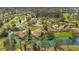 Aerial view of community near golf course and lake at 545 Brown Pelican Dr, Daytona Beach, FL 32119