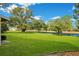 Backyard with pond view and lush landscaping at 545 Brown Pelican Dr, Daytona Beach, FL 32119