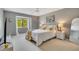 Spacious bedroom featuring gray walls, a comfortable bed and a large window at 545 Brown Pelican Dr, Daytona Beach, FL 32119