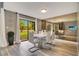 Modern dining room with white table and chairs, and large mirror at 545 Brown Pelican Dr, Daytona Beach, FL 32119