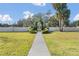 Landscaped entrance with a gate at 600 Northern Way # 801, Winter Springs, FL 32708