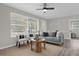 Living Room with gray sofa and large window at 610 Roma St, Daytona Beach, FL 32114